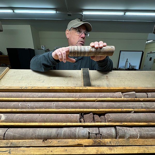 Erik Scott portrait with sedimentary cores