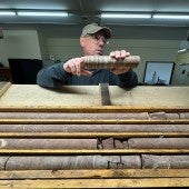 Erik Scott portrait with sedimentary cores